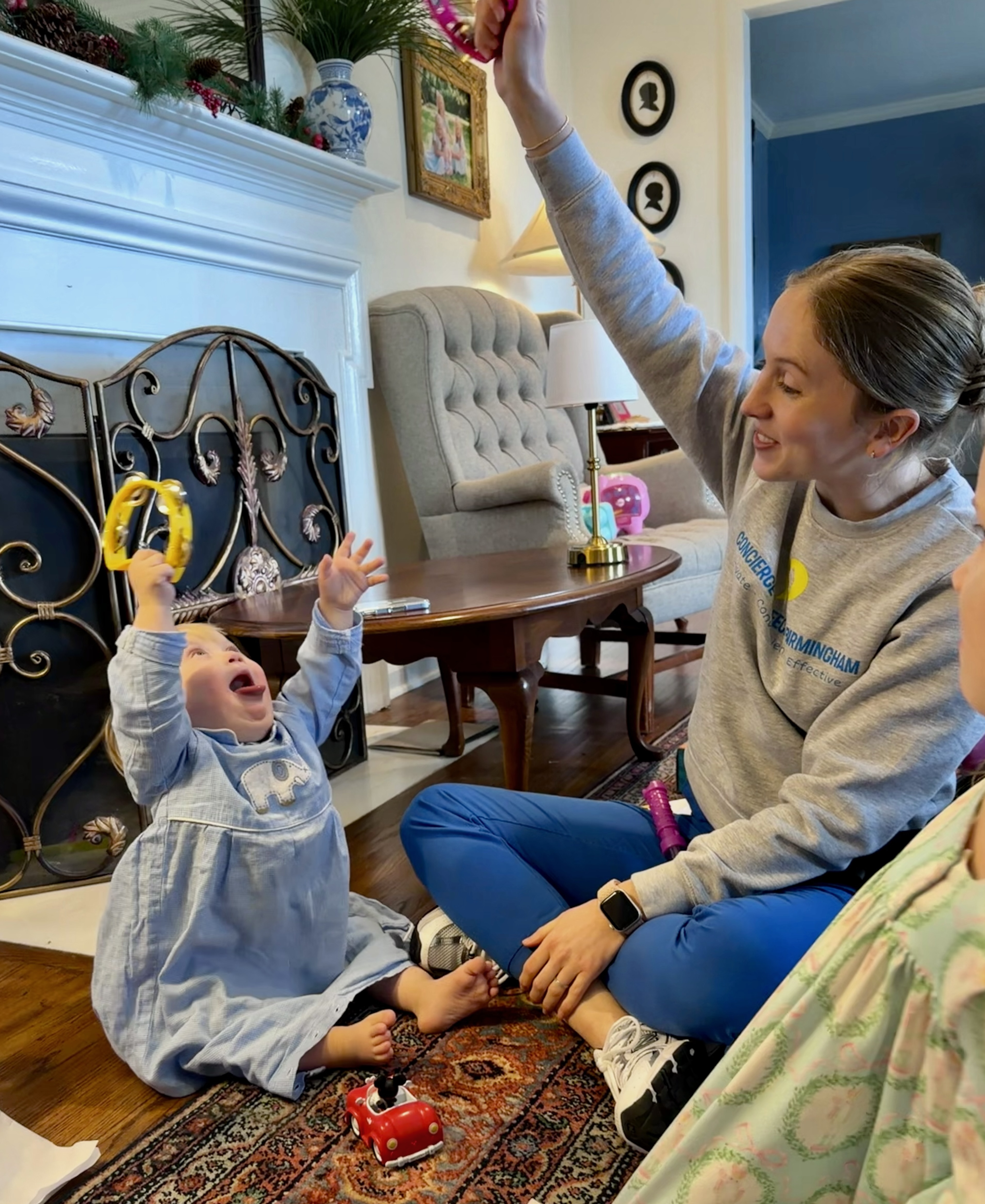 Speech therapist engaging with a child during an in-home session
