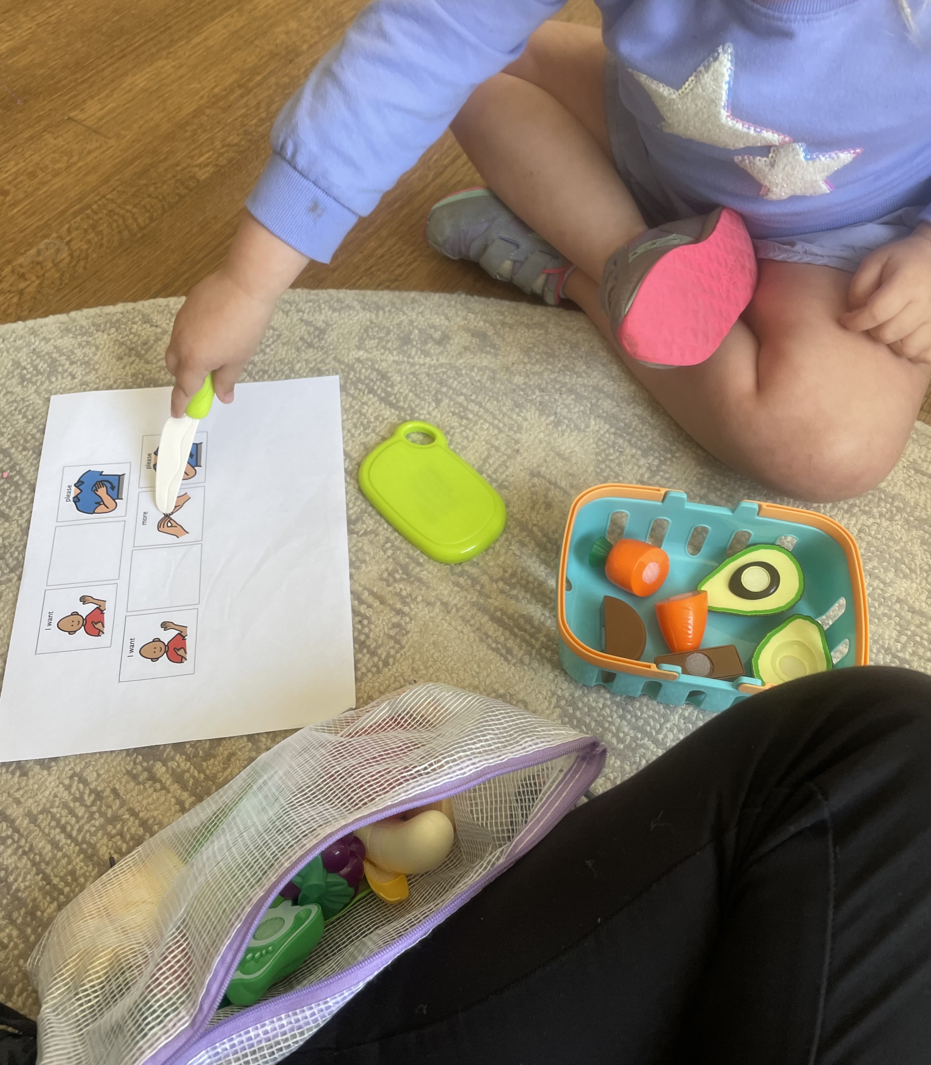 AAC speech therapy with communication device during play