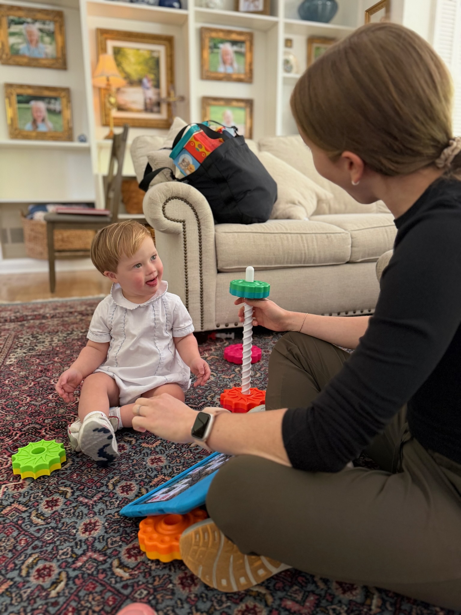 Pediatric speech therapist working with a child at home