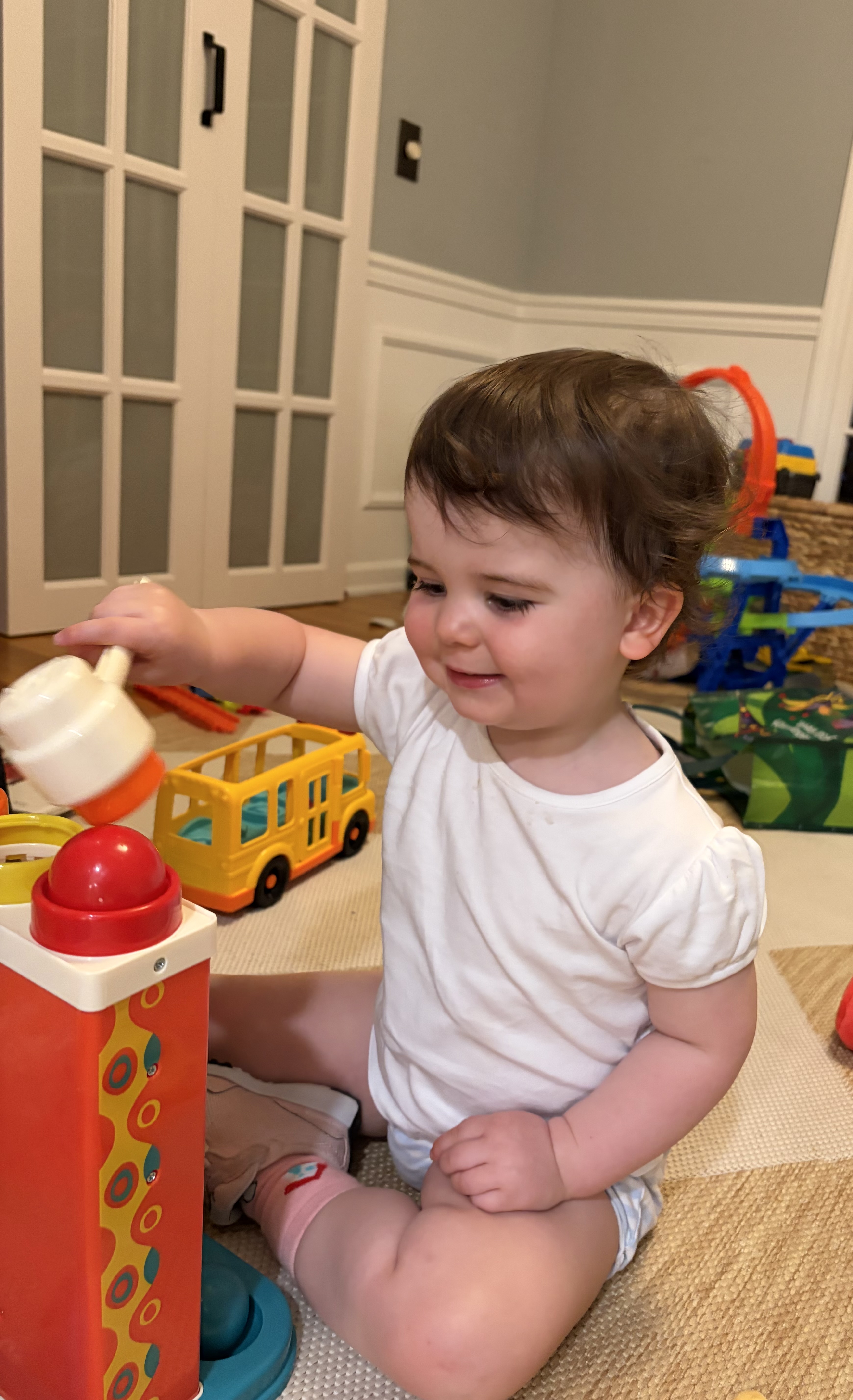 Child engaged in play-based speech therapy at home